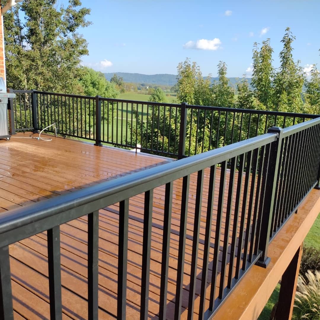 Deck with black aluminum railings overlooking mountain view