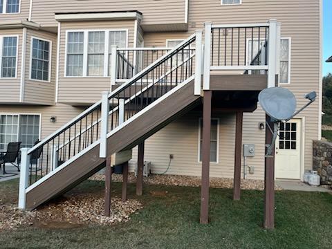 Elevated deck with surface, railings, and stairs all upgraded together