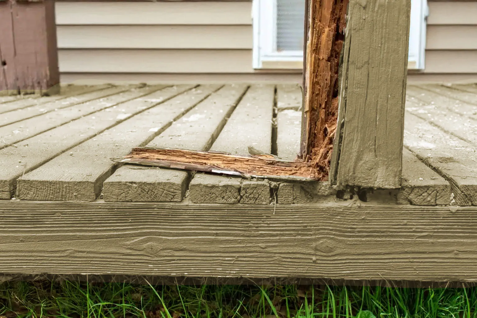Rotted deck post base showing structural compromise